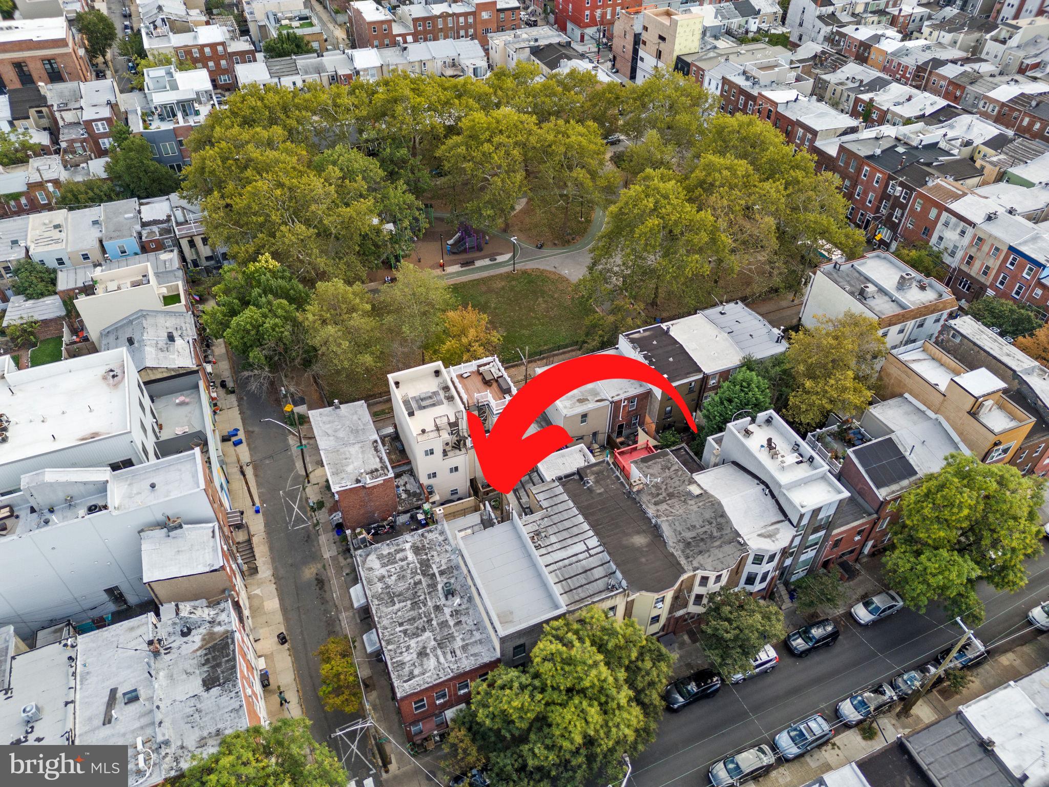 an aerial view of a houses with yard