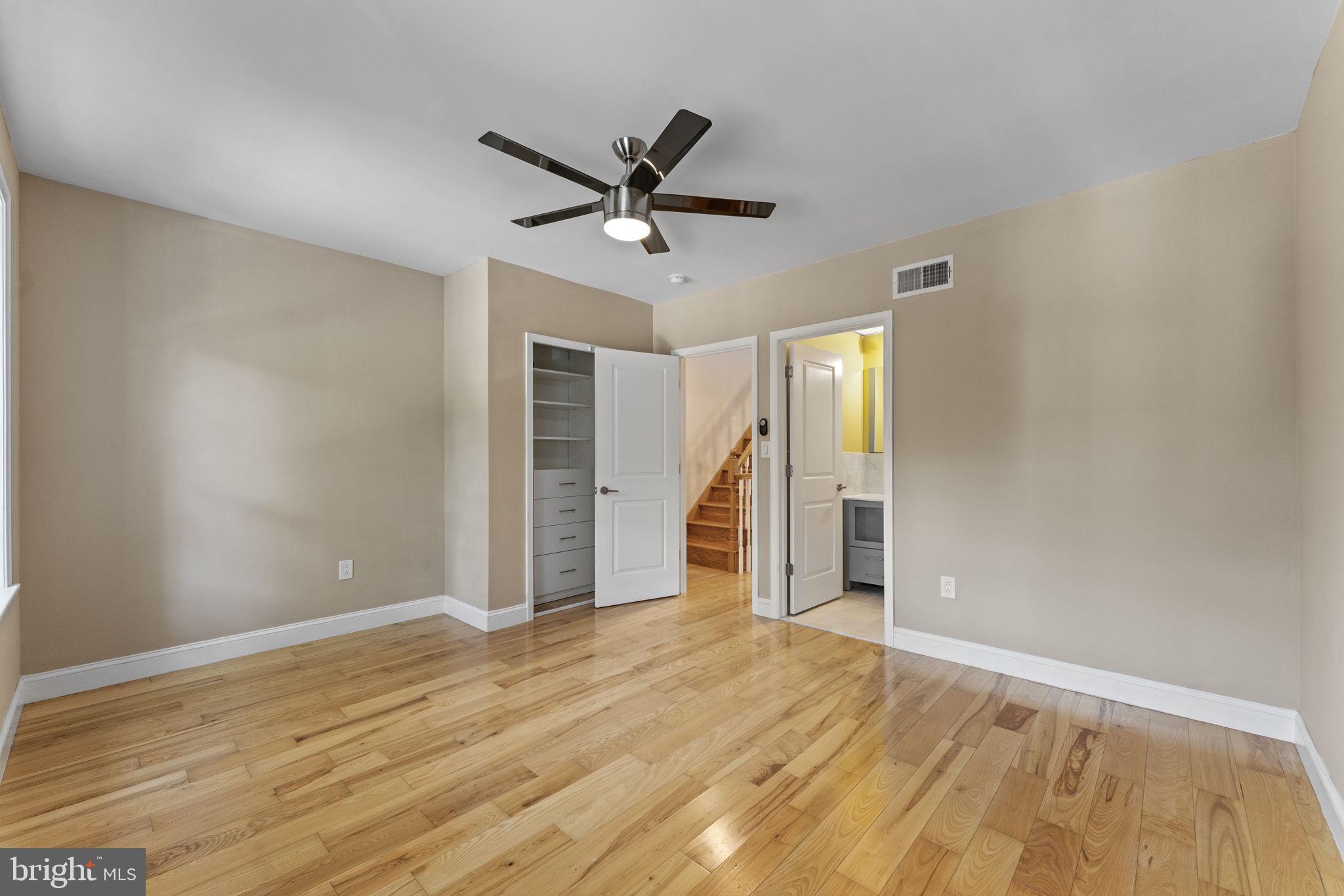 1225 South 7th Street Philadelphia, PA 19147 - Photo 14 of 33 a view of a livingroom with wooden floor and a ceiling fan