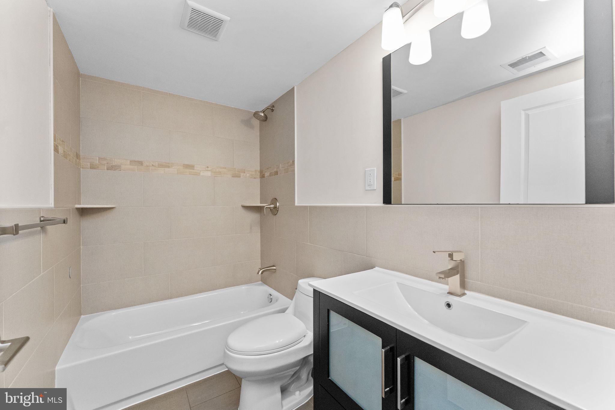 1225 South 7th Street Philadelphia, PA 19147 - Photo 15 of 33 a bathroom with a sink a toilet and shower