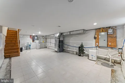 a view of livingroom with stairs and furniture