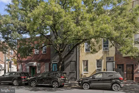 a car parked in front of a house