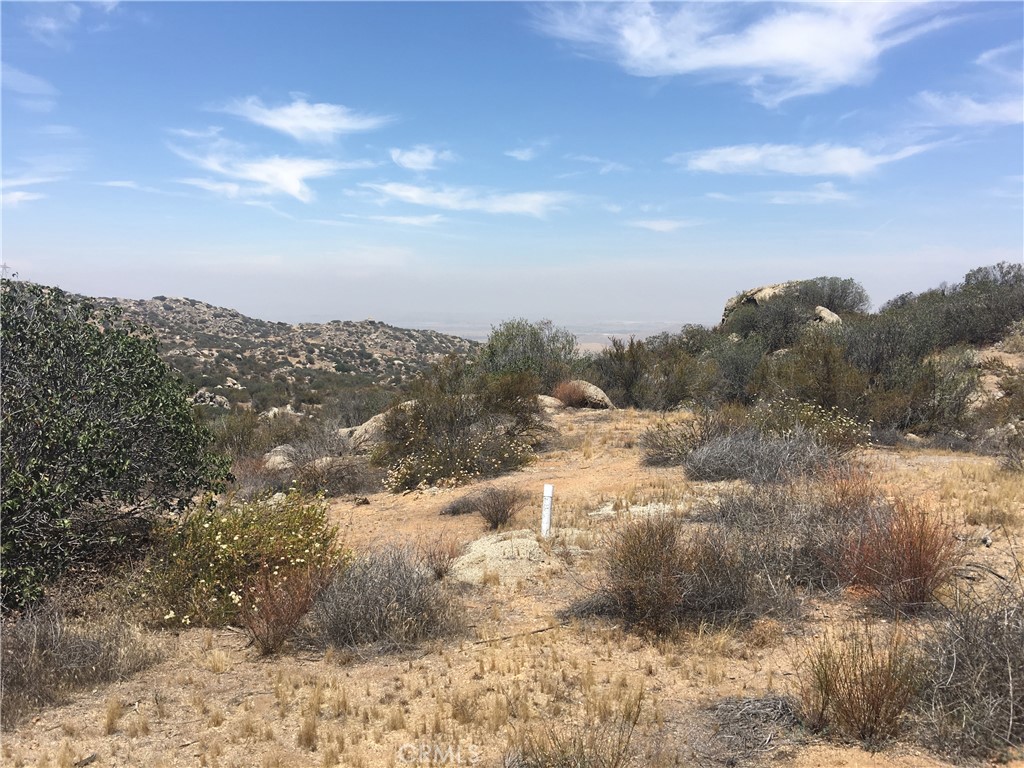 23016 Sky Mesa Road Homeland, CA 92548 - Photo 11 of 16 a view of a town with mountains in the background