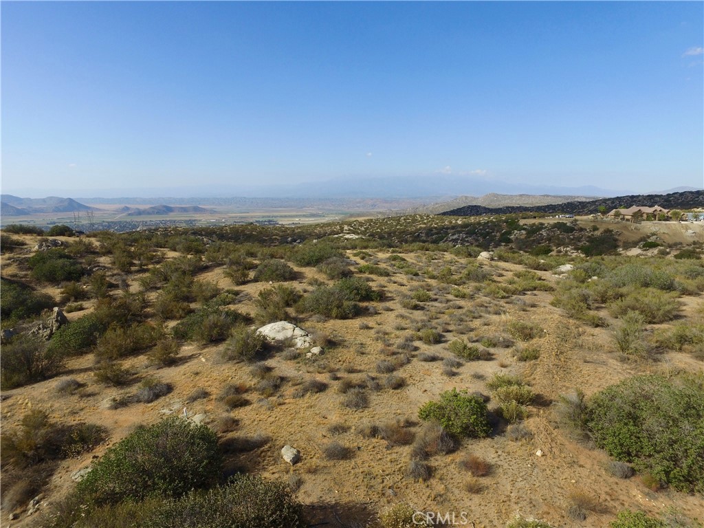 23016 Sky Mesa Road Homeland, CA 92548 - Photo 8 of 16 an aerial view of residential houses with city view