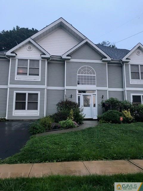 115 Winthrop Road Edison, NJ 08817 - Photo 1 of 2 a front view of a house with a garden