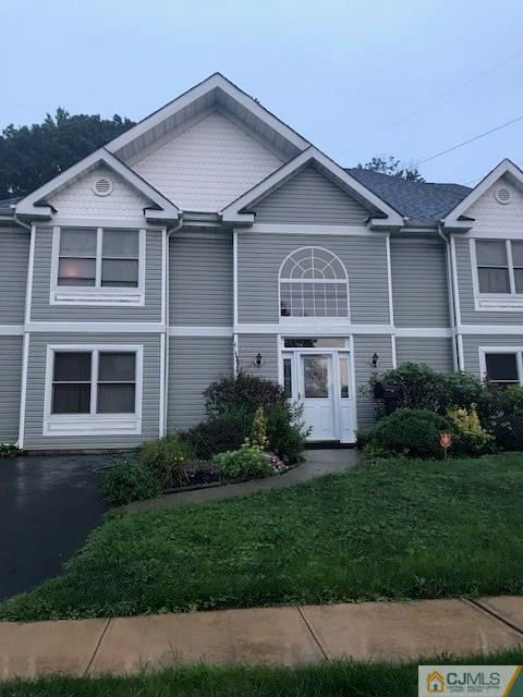 115 Winthrop Road Edison, NJ 08817 - Photo 2 of 2 a front view of a house with a yard