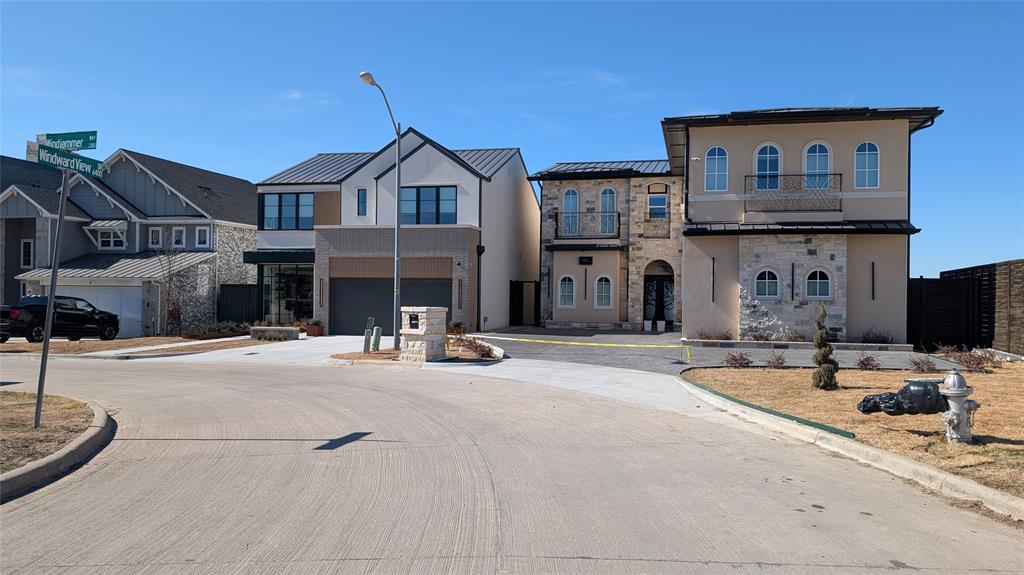 6502 Windward View Drive Rowlett, TX 75088 - Photo 22 of 23 a front view of a house with yard and parking