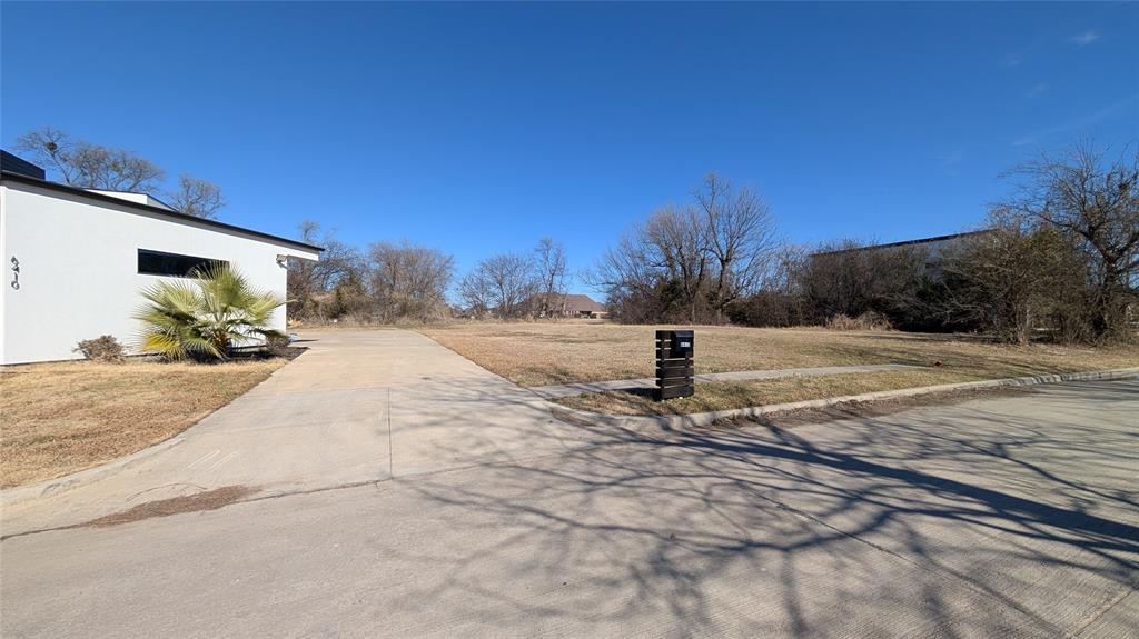 6502 Windward View Drive Rowlett, TX 75088 - Photo 23 of 23 a view of a house with a yard