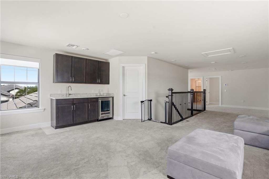 19696 Aqua View Lane Fort Myers, FL 33913 - Photo 25 of 50 a living room with furniture and a flat screen tv