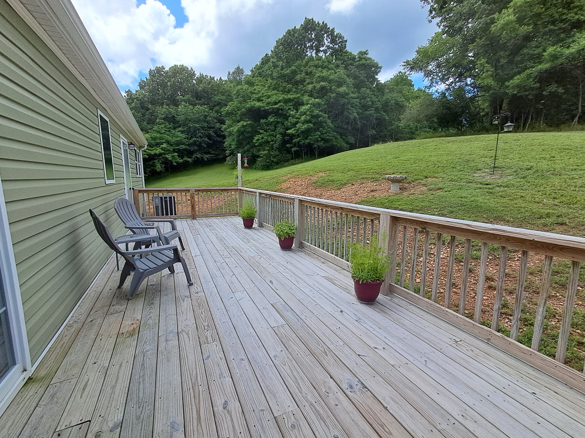 5525 Wiley Hollow Road Culleoka, TN 38451 - Photo 58 of 64 a view of deck with table and chairs and wooden floor