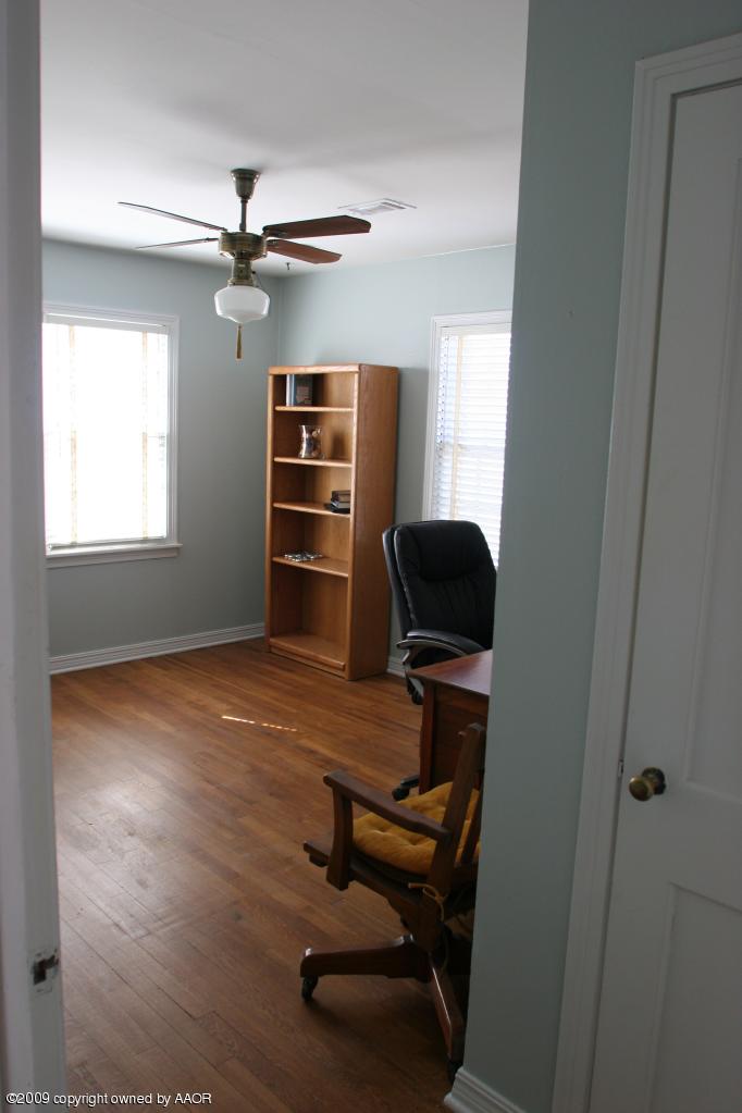 3622 South Travis Street Amarillo, TX 79110 - Photo 22 of 32 a view of a workspace with furniture and a window
