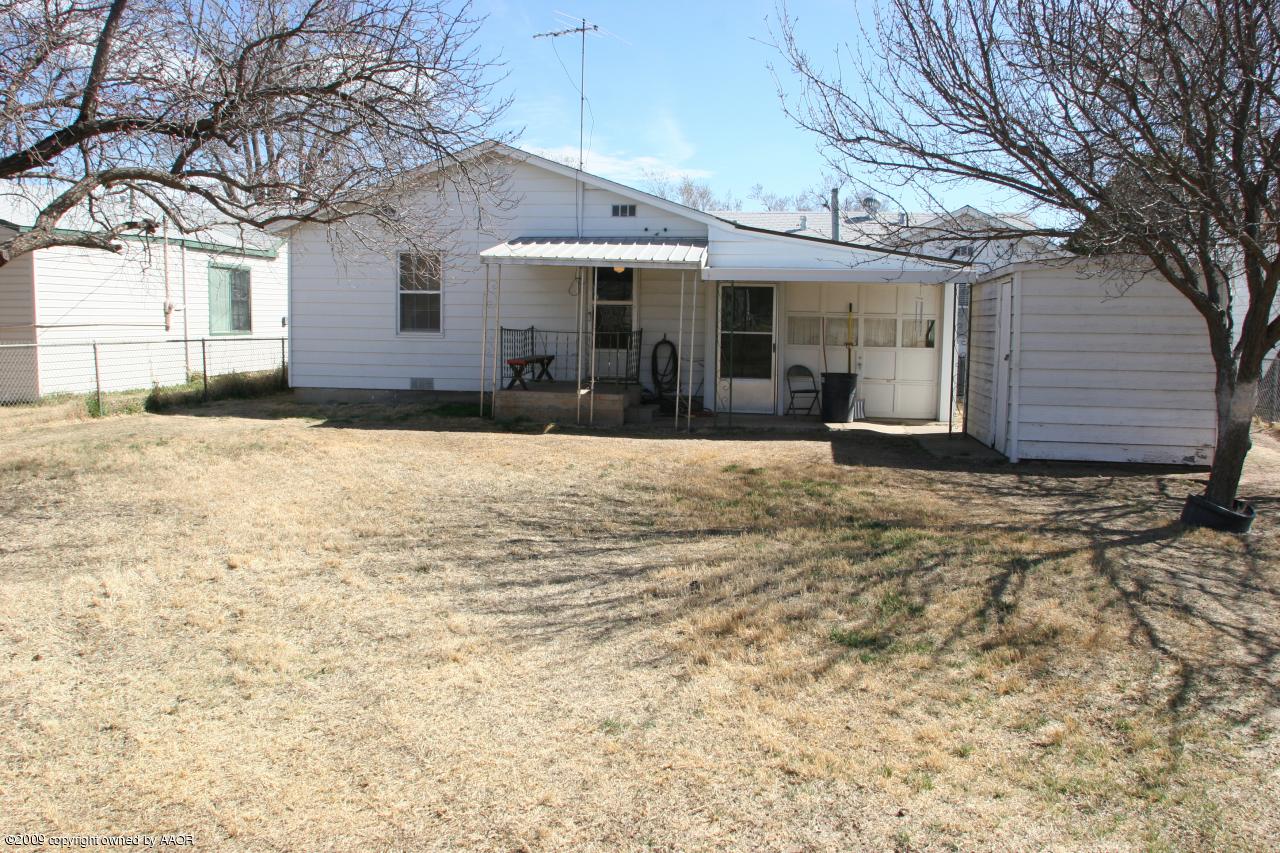 3622 South Travis Street Amarillo, TX 79110 - Photo 27 of 32 a front view of a house with a yard and garage