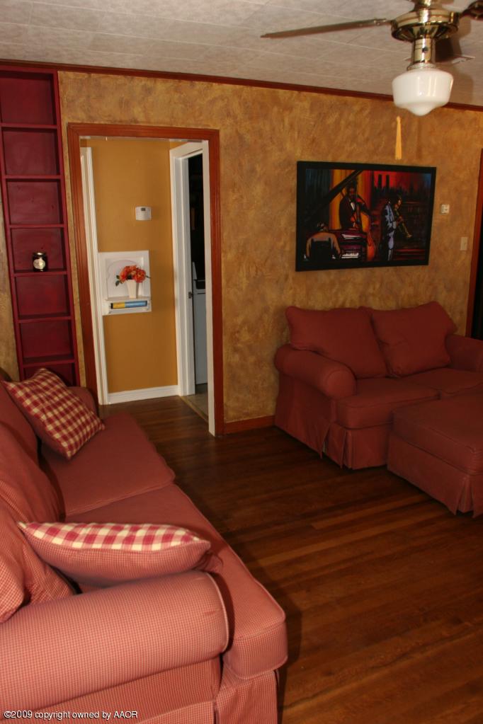 3622 South Travis Street Amarillo, TX 79110 - Photo 6 of 32 a living room with couch and a fireplace