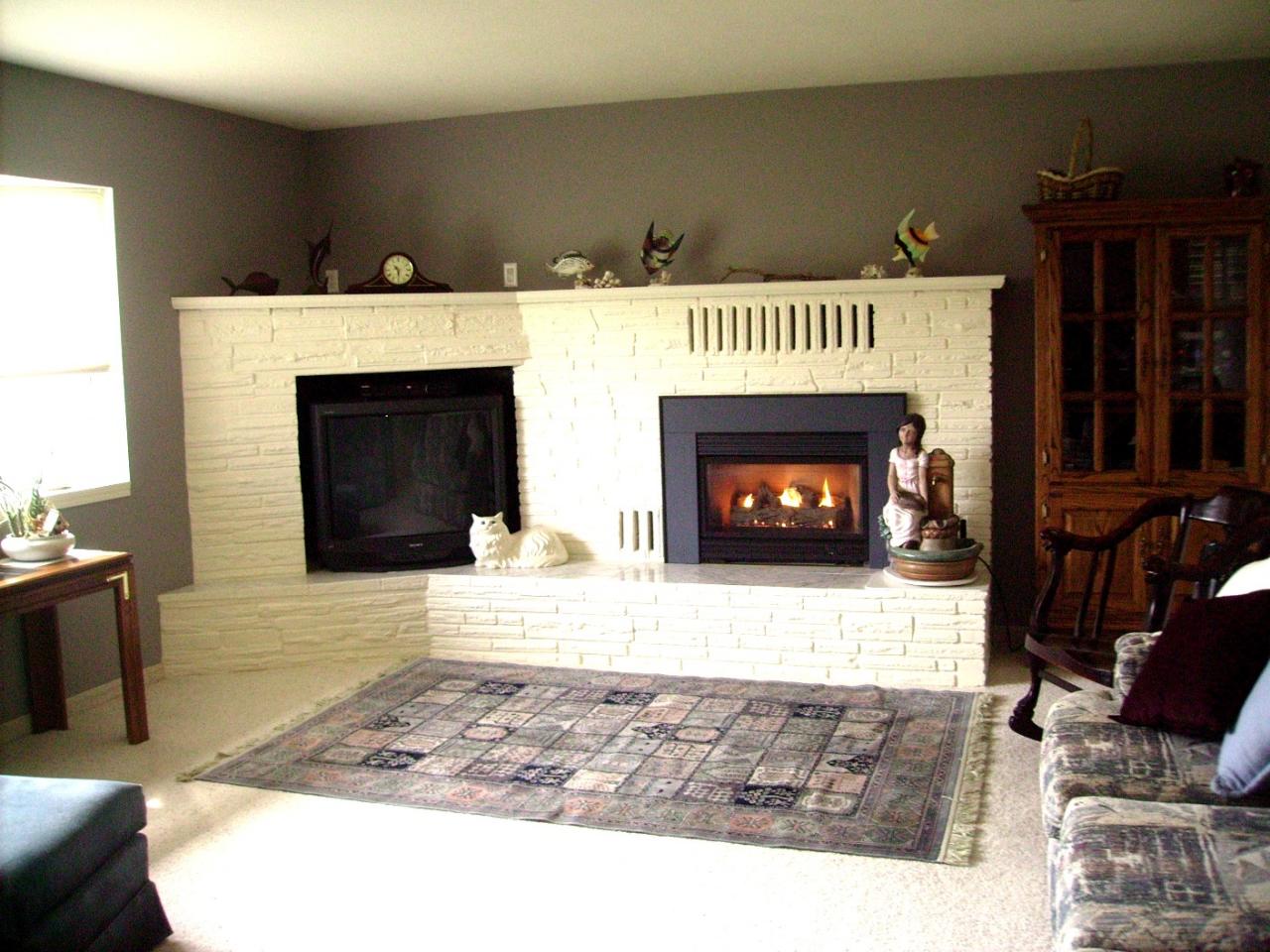 1311 Appleway Road Grandview, WA 98930 - Photo 5 of 8 a living room with a fireplace a rug and a fireplace