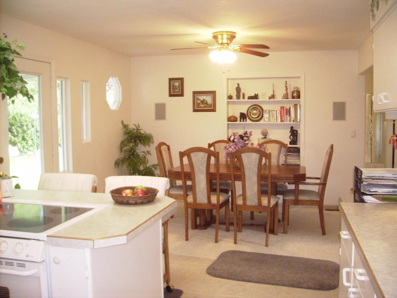 1311 Appleway Road Grandview, WA 98930 - Photo 6 of 8 a dining room with furniture and wooden floor