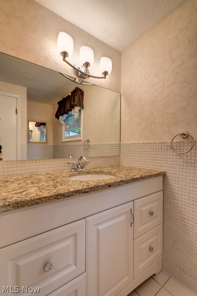 4949 Brainard Road Orange, OH 44022 - Photo 17 of 24 Higher height vanity with granite and undermount sink...