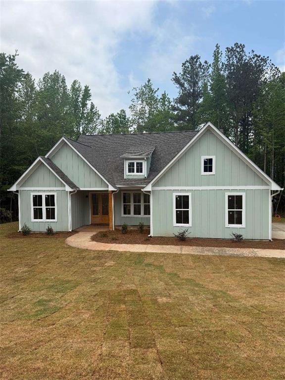 27 Rosemary Way Buchanan, GA 30113 - Photo 1 of 1 a front view of house with yard and trees
