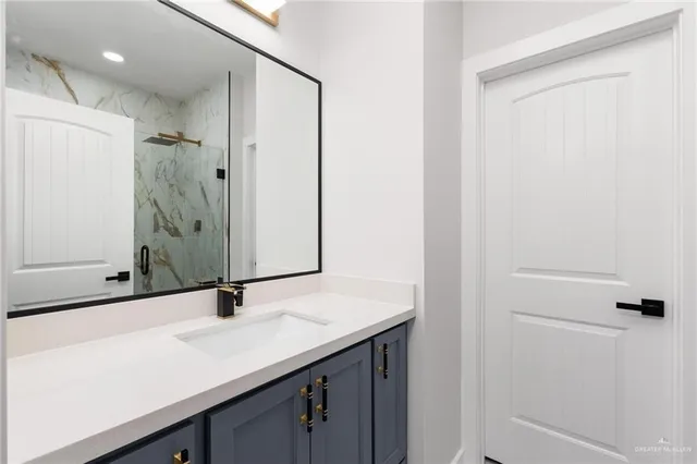 a bathroom with a sink and a mirror