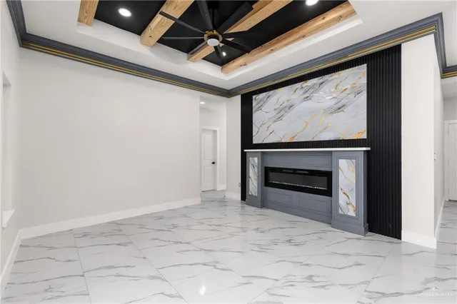 a view of empty room with a fireplace