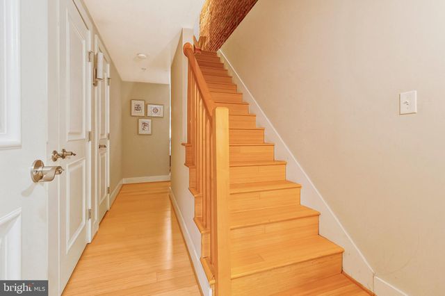 a view of a staircase with white walls