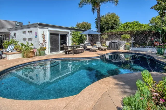 a view of a swimming pool with a patio