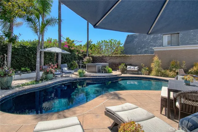 a view of swimming pool with outdoor seating