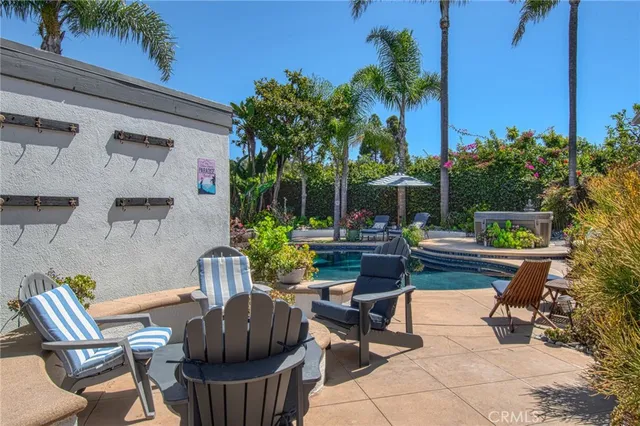 a view of a patio with couches and potted plants