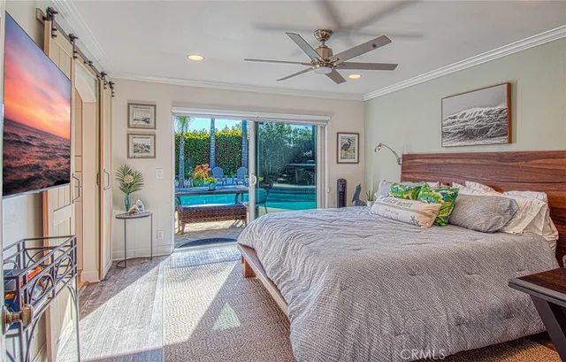 a bedroom with a large bed and a large window