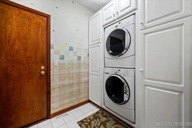 a view of a hallway with washer and dryer