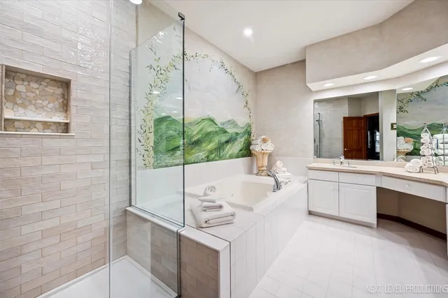 a large white kitchen with a large window