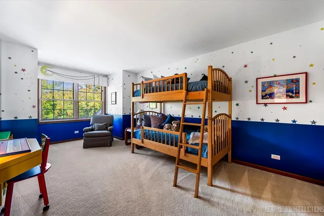 a bedroom with furniture and a window