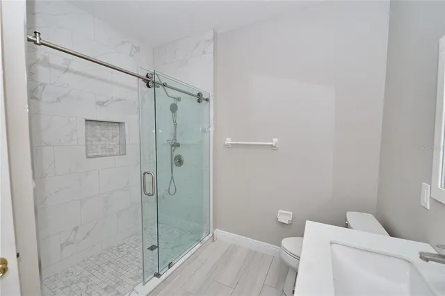 a view of backyard with wooden fence