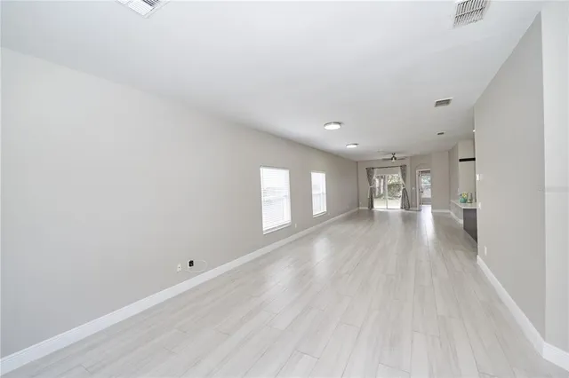 a view of a kitchen with a sink and a refrigerator