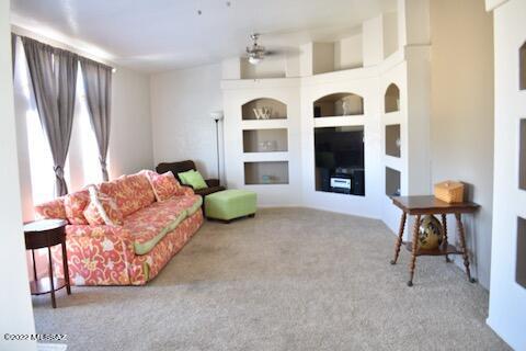 13643 East Bright Sky Loop Vail, AZ 85641 - Photo 7 of 22 a living room with furniture and a large window