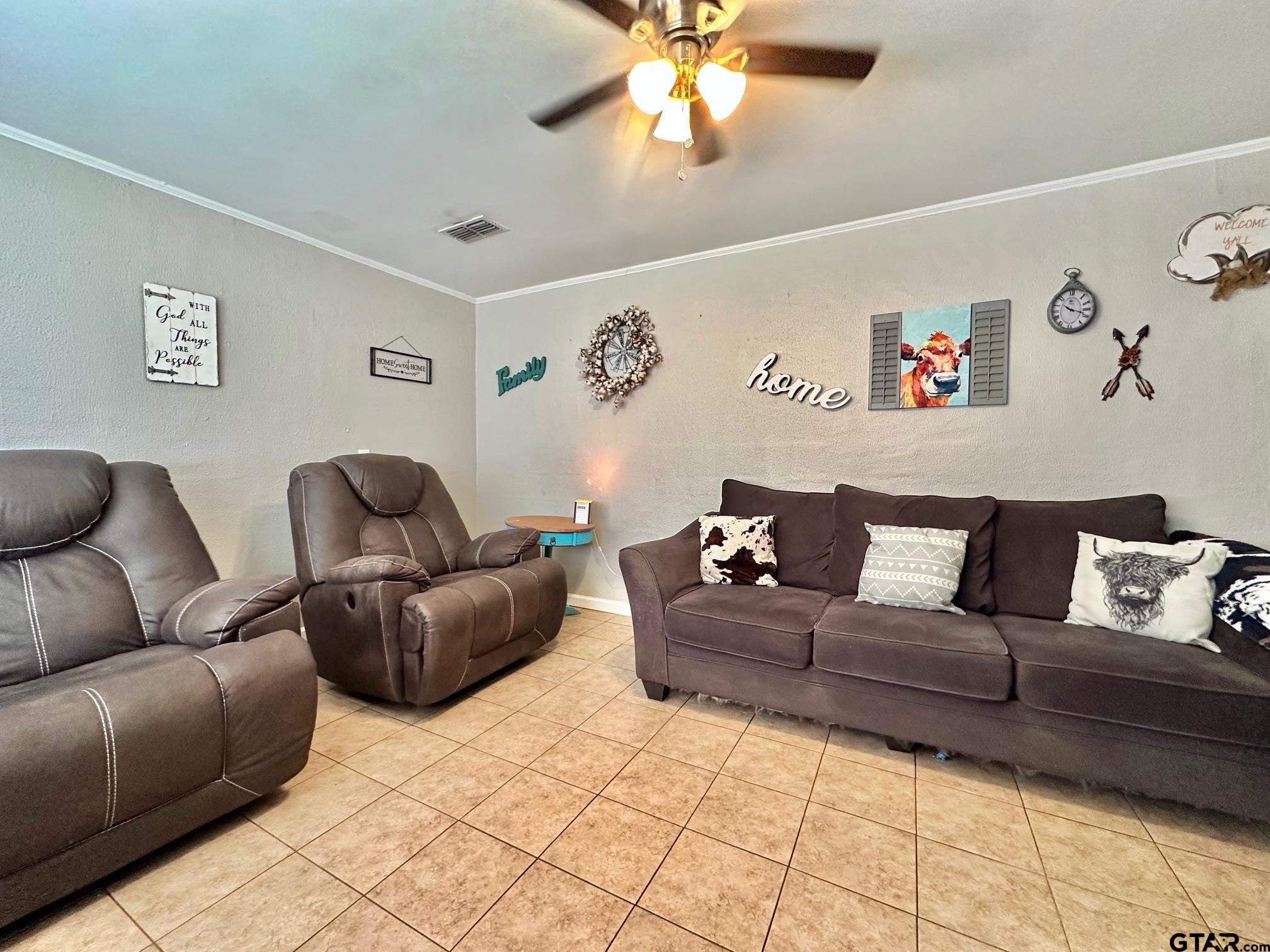 2601 East George Richey Road Longview, TX 75604 - Photo 6 of 26 a living room with a couch and a couch