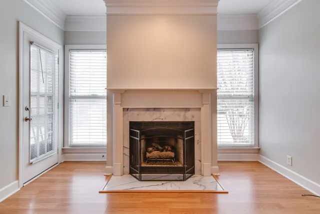 a view of an empty room and wooden floor