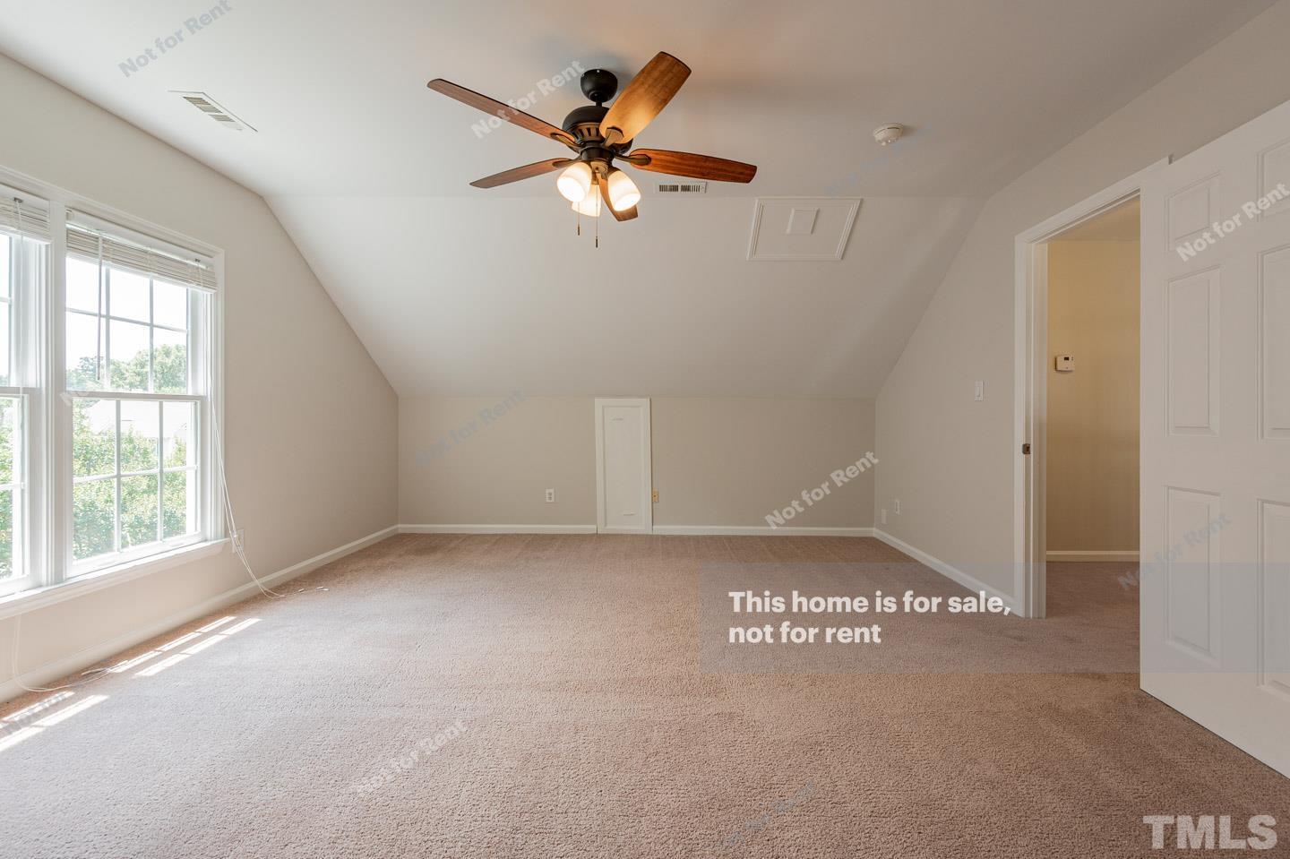 12228 Breton Lane Raleigh, NC 27613 - Photo 5 of 28 a view of an empty room with a window