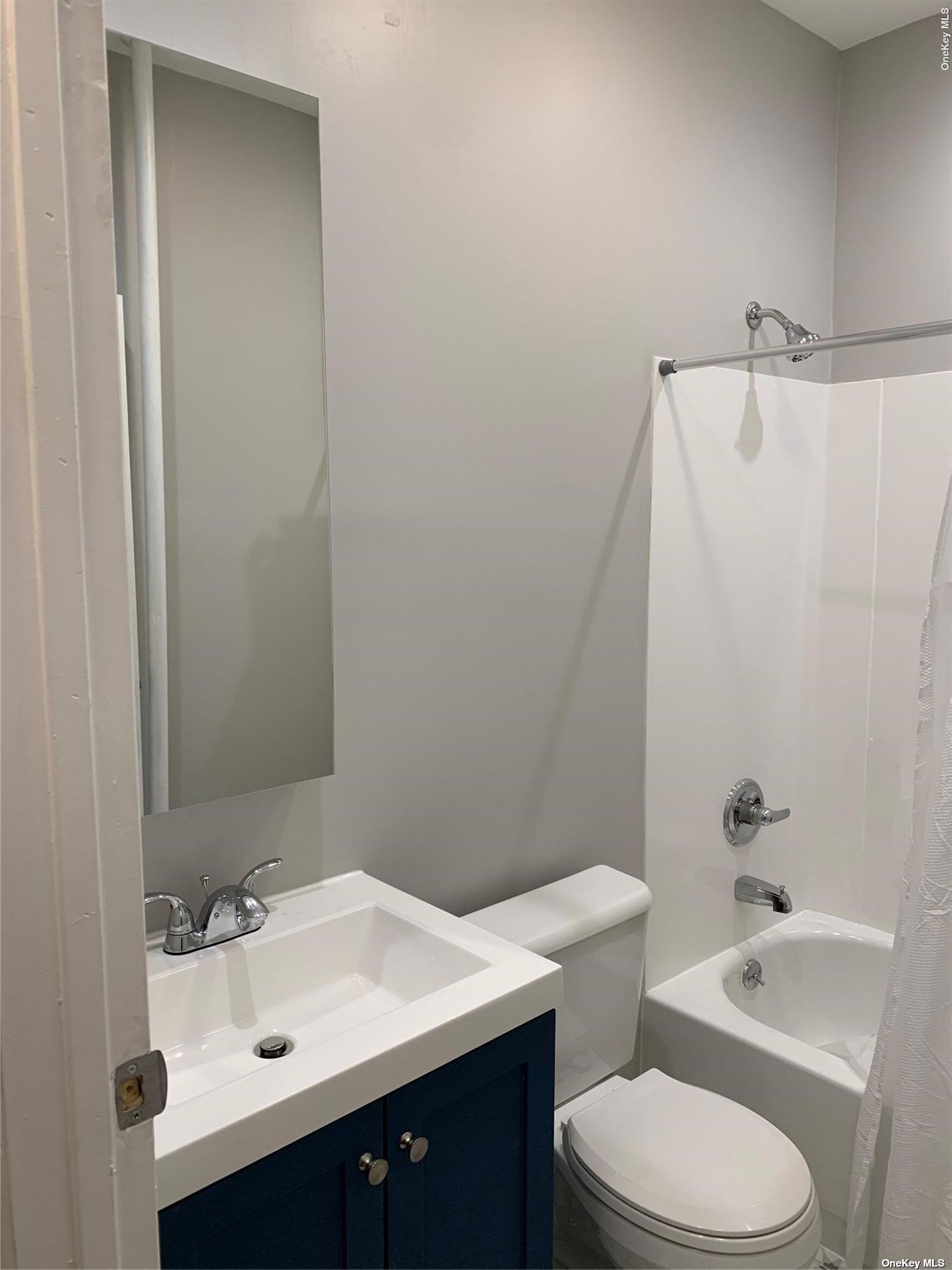 32 Sutton Street Brooklyn, NY 11222 - Photo 11 of 35 a bathroom with a sink a toilet and shower