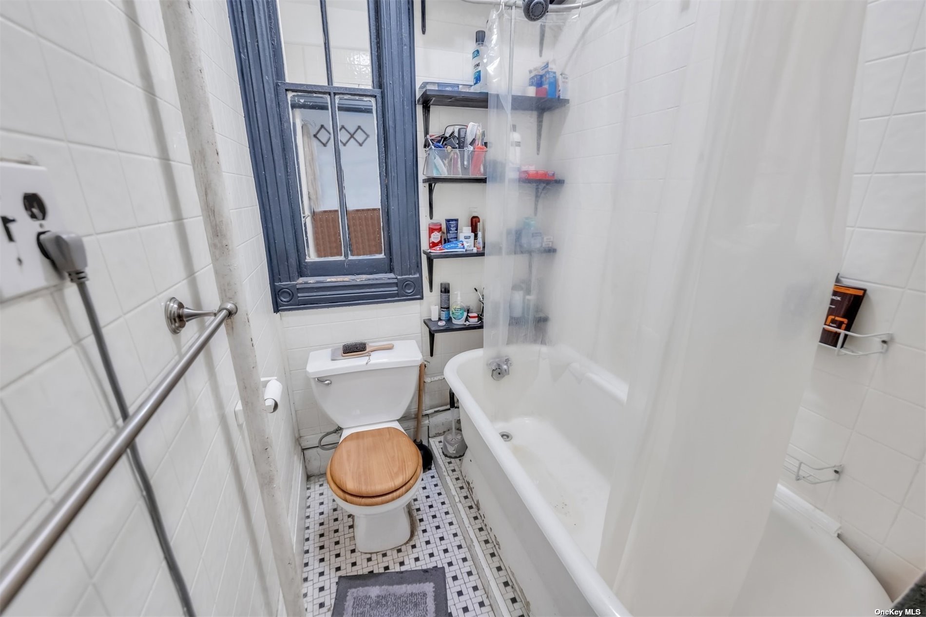 32 Sutton Street Brooklyn, NY 11222 - Photo 14 of 35 a bathroom with a bathtub and a shower