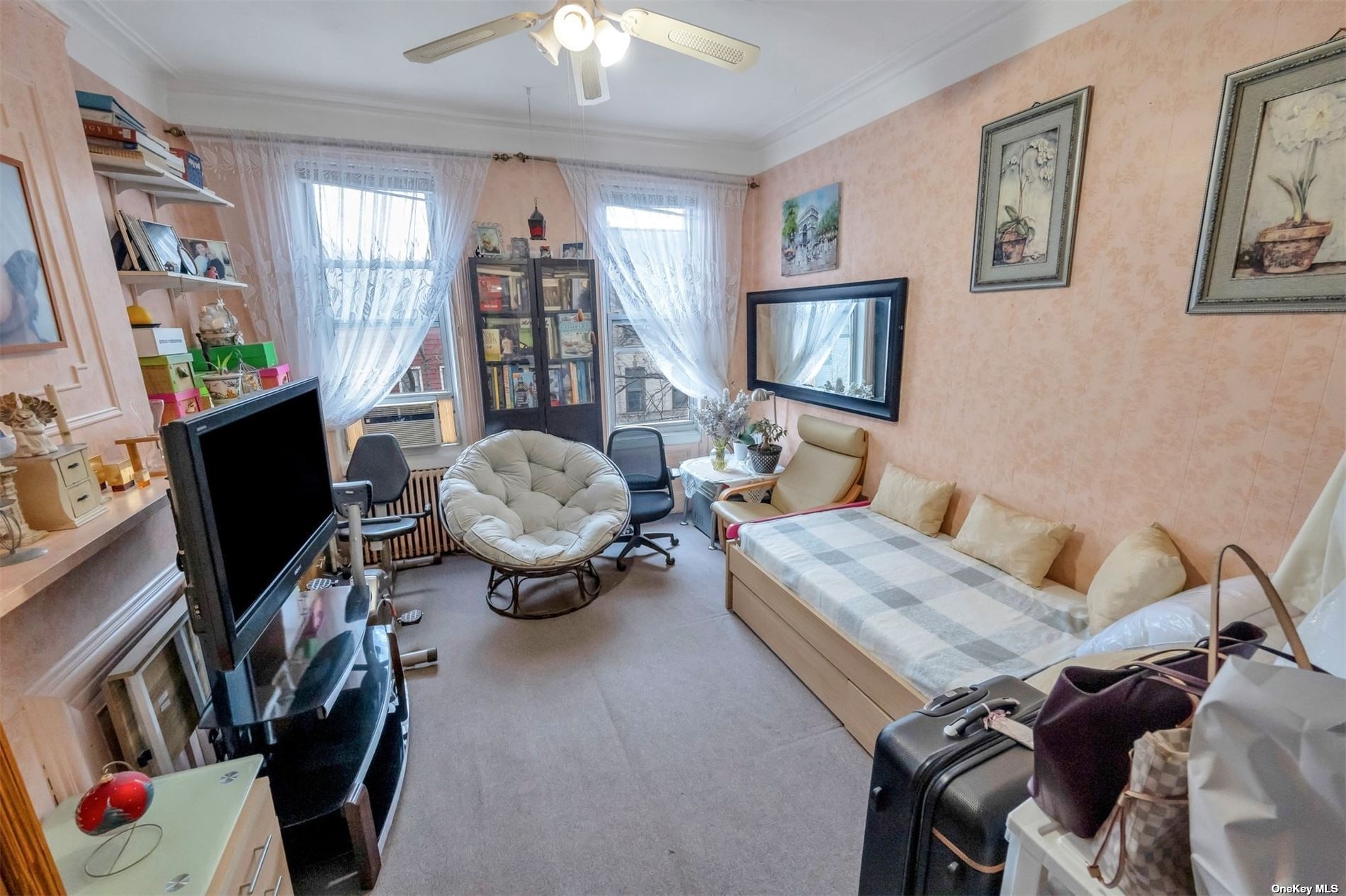 32 Sutton Street Brooklyn, NY 11222 - Photo 21 of 35 a living room with furniture and a flat screen tv