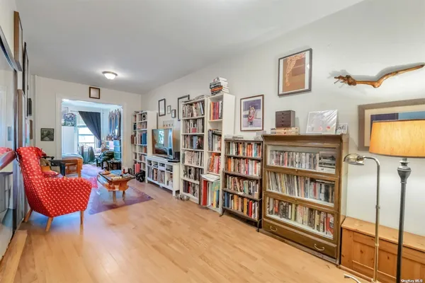 a living room with large lots of furniture and a flat screen tv