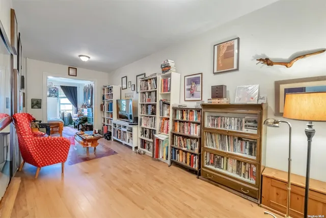 a living room with large lots of furniture and a flat screen tv