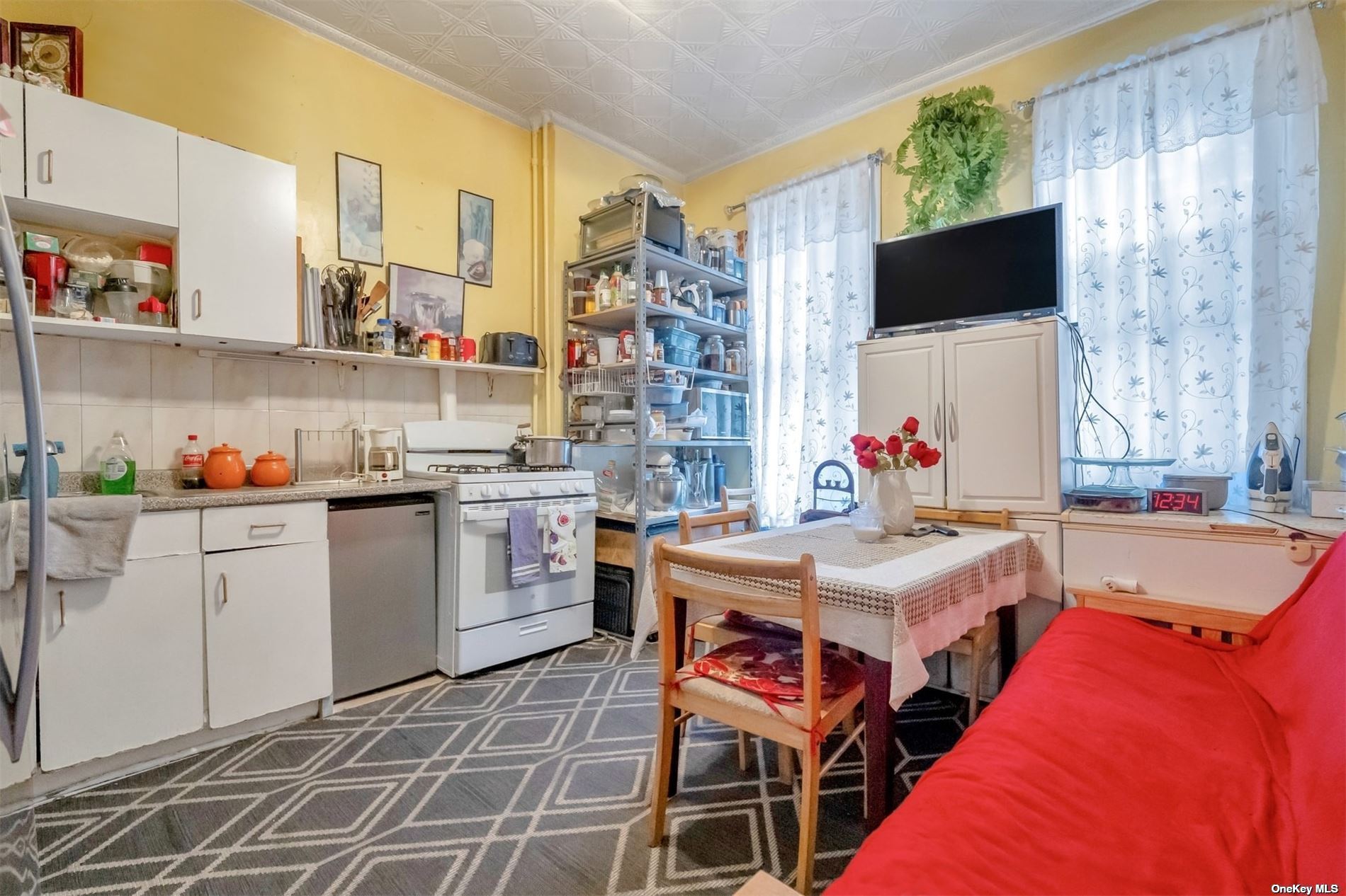 32 Sutton Street Brooklyn, NY 11222 - Photo 32 of 35 a kitchen that has a lot of counter space and a sink