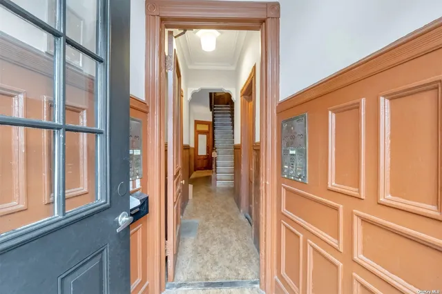 a view of a stairs and wooden floor