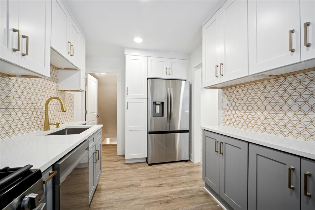 803 Brummel Street Evanston, IL 60202 - Photo 11 of 21 a kitchen with stainless steel appliances granite countertop a refrigerator and a sink