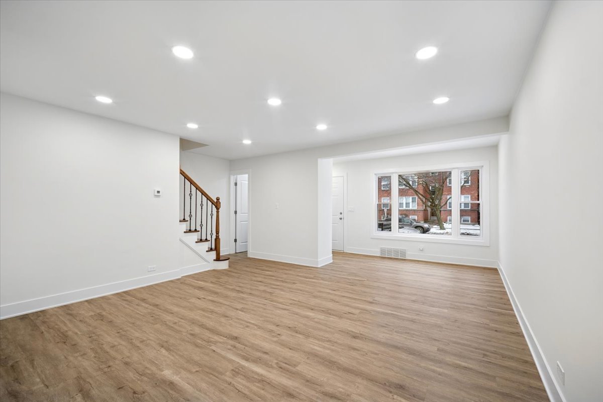 803 Brummel Street Evanston, IL 60202 - Photo 3 of 21 a view of an empty room with wooden floor