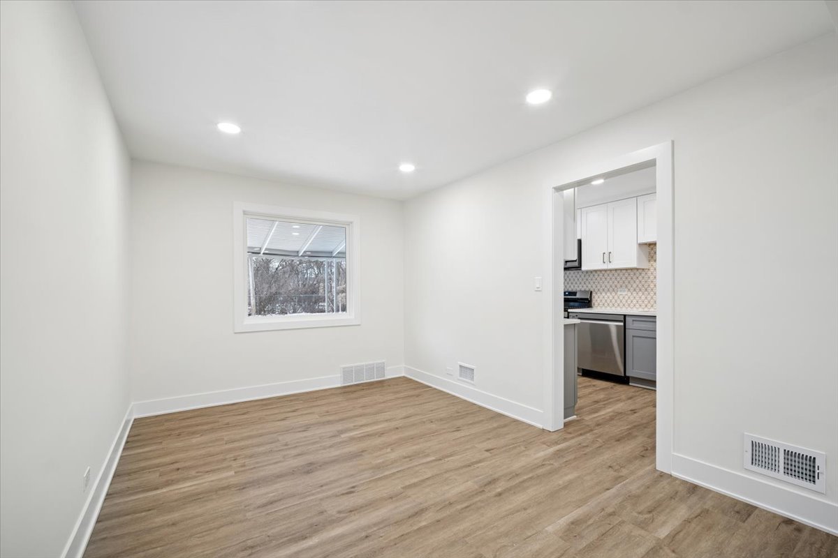 803 Brummel Street Evanston, IL 60202 - Photo 7 of 21 a view of a kitchen cabinets and wooden floor