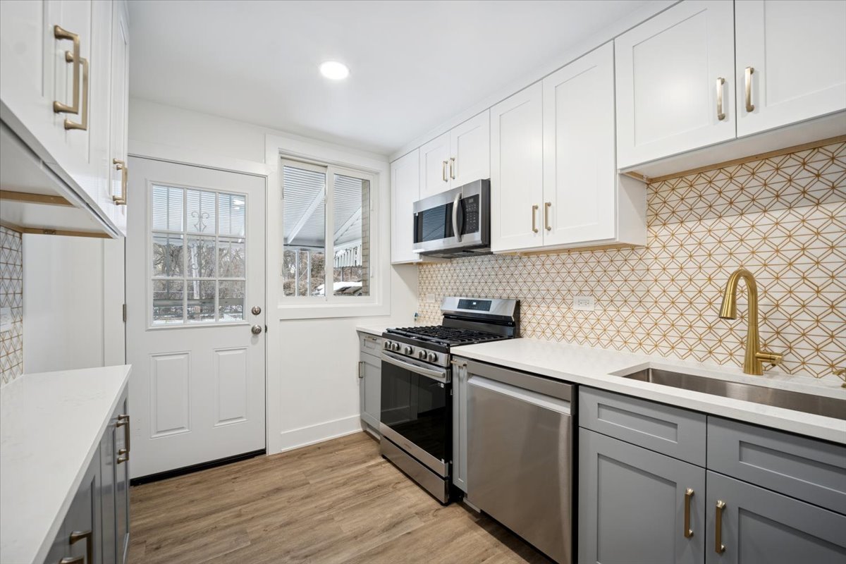 803 Brummel Street Evanston, IL 60202 - Photo 10 of 21 a kitchen with a sink stove and microwave