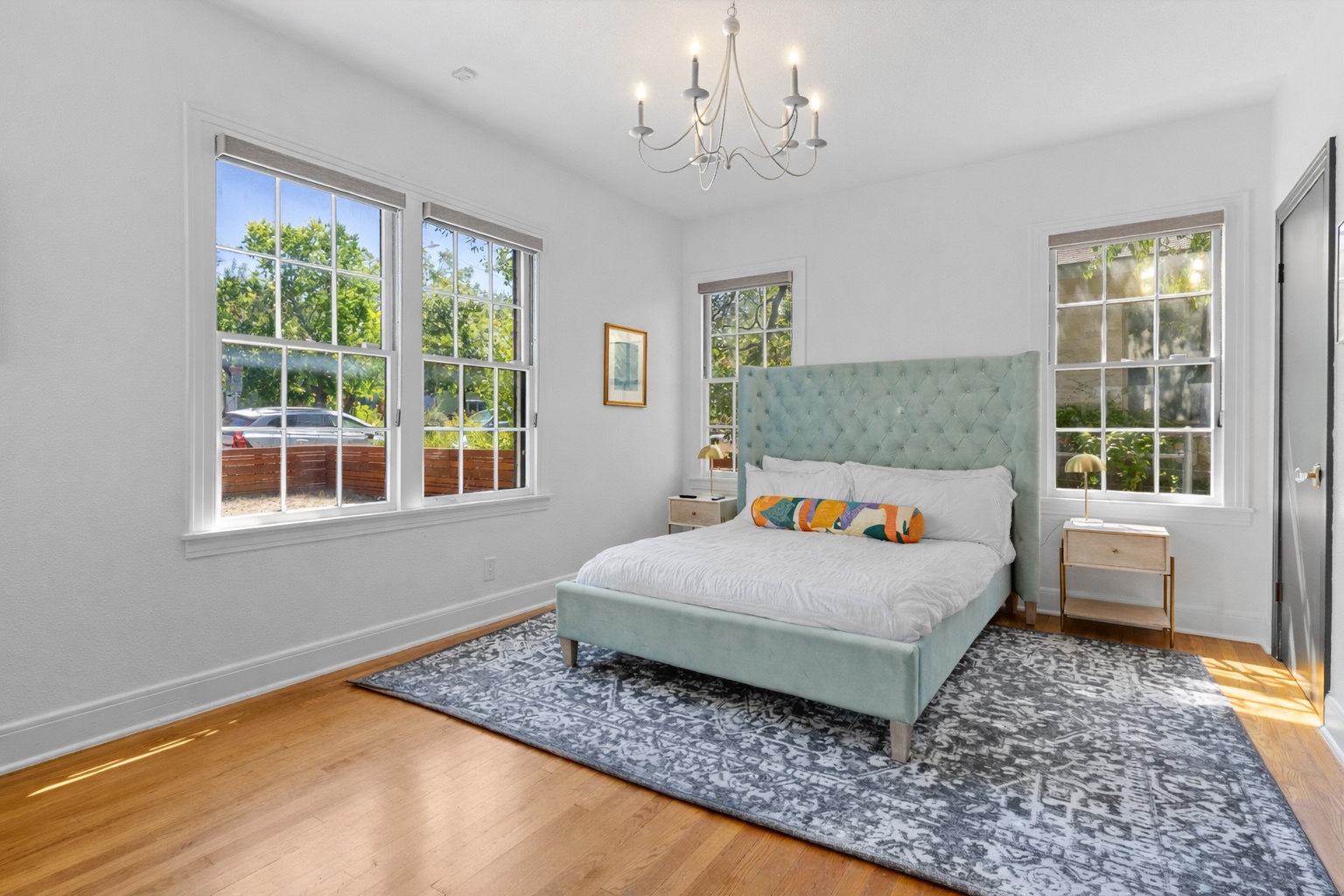 2106 Eva Street Austin, TX 78704 - Photo 11 of 13 a bedroom with a large bed and a window