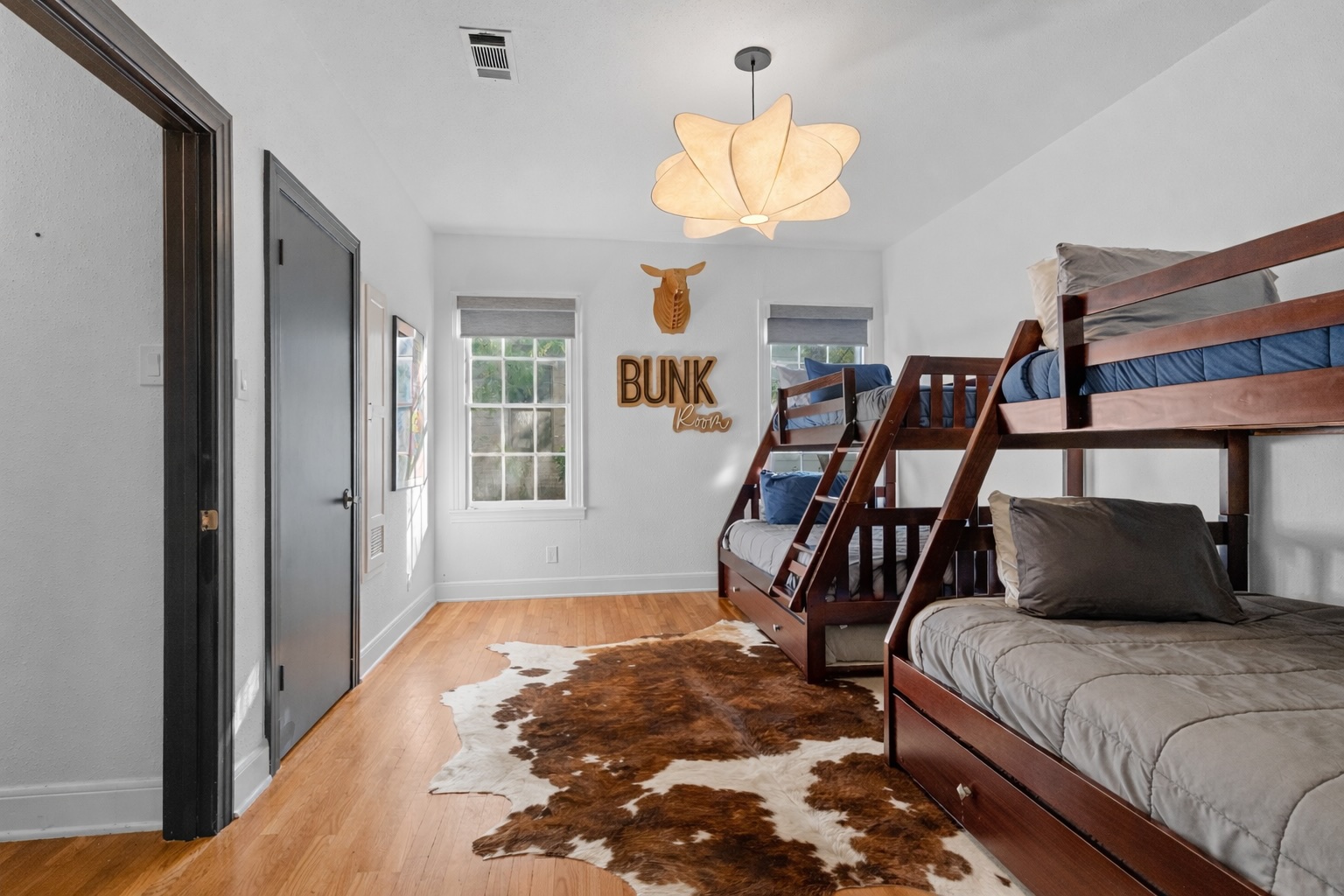 2106 Eva Street Austin, TX 78704 - Photo 13 of 13 a bedroom with a bed and wooden floor