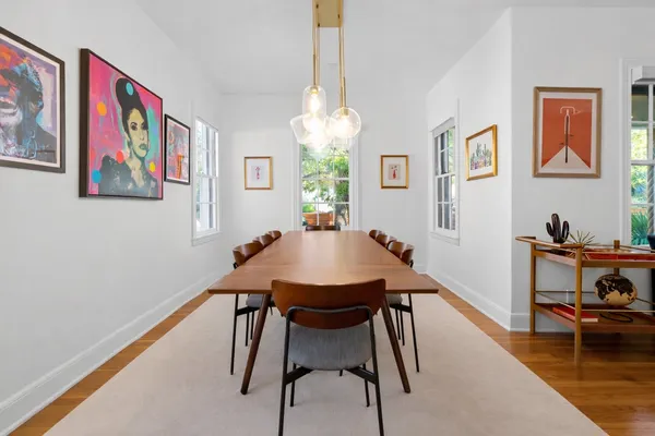 a view of a dining room with furniture window and wooden floor